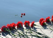 Baku residents bringing flowers to Seaside Boulevard to honor missing oil workers.  Azerbaijan, Dec.07, 2015